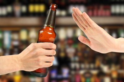 hand reject a bottle of beer in the bar