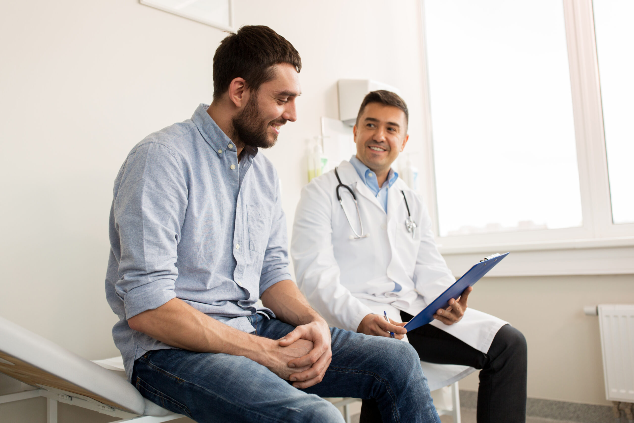 Medicine,,Healthcare,And,People,Concept,-,Smiling,Doctor,With,Clipboard