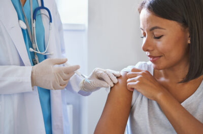 Young,Afro,American,Woman,Receiving,Injection,Of,Coronavirus,Vaccine,During